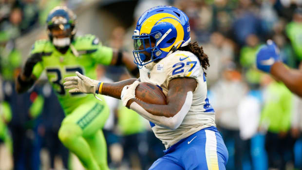 Oct 7, 2021; Seattle, Washington, USA; Los Angeles Rams running back Darrell Henderson (27) rushes against the Seattle Seahawks during the first quarter at Lumen Field. Mandatory Credit: Joe Nicholson-USA TODAY Sports